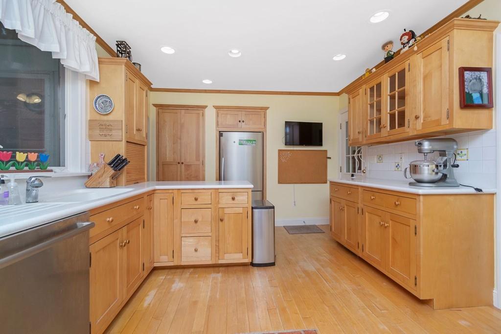 142 Kirkstall Road Newton, MA 02460 - Photo 10 of 23 a large kitchen with stainless steel appliances lots of counter top space