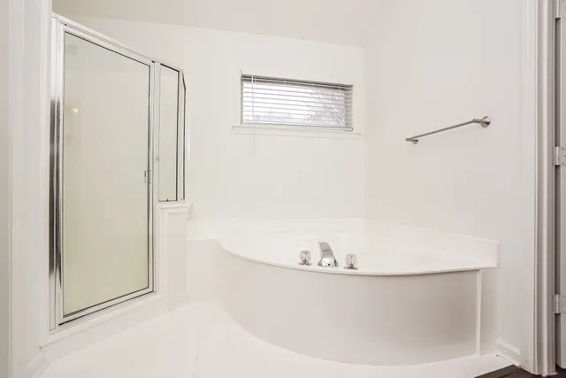 a white bath tub sitting in a bathroom
