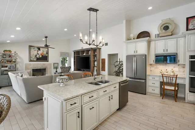 a kitchen with stainless steel appliances a refrigerator a stove a microwave and cabinets