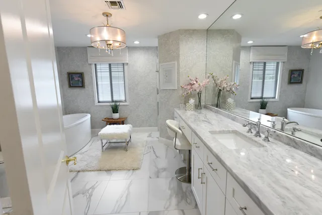 a spacious bathroom with a double vanity sink and a mirror
