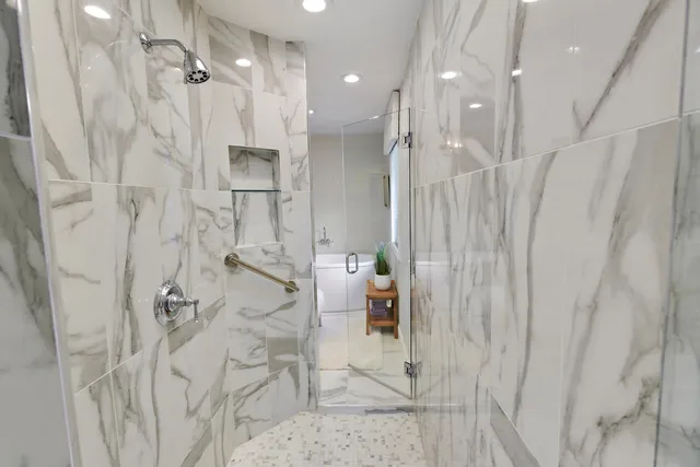 a bathroom with a toilet a sink and bathtub