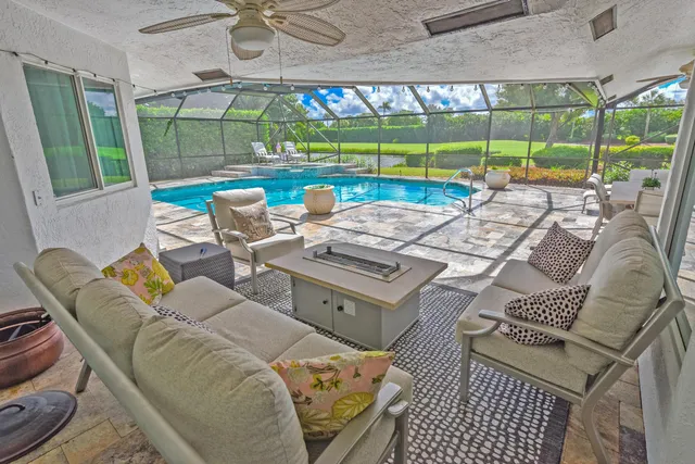 a view of a backyard with swimming pool