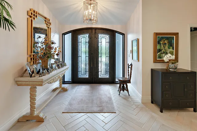 a view of staircase with furniture and a window
