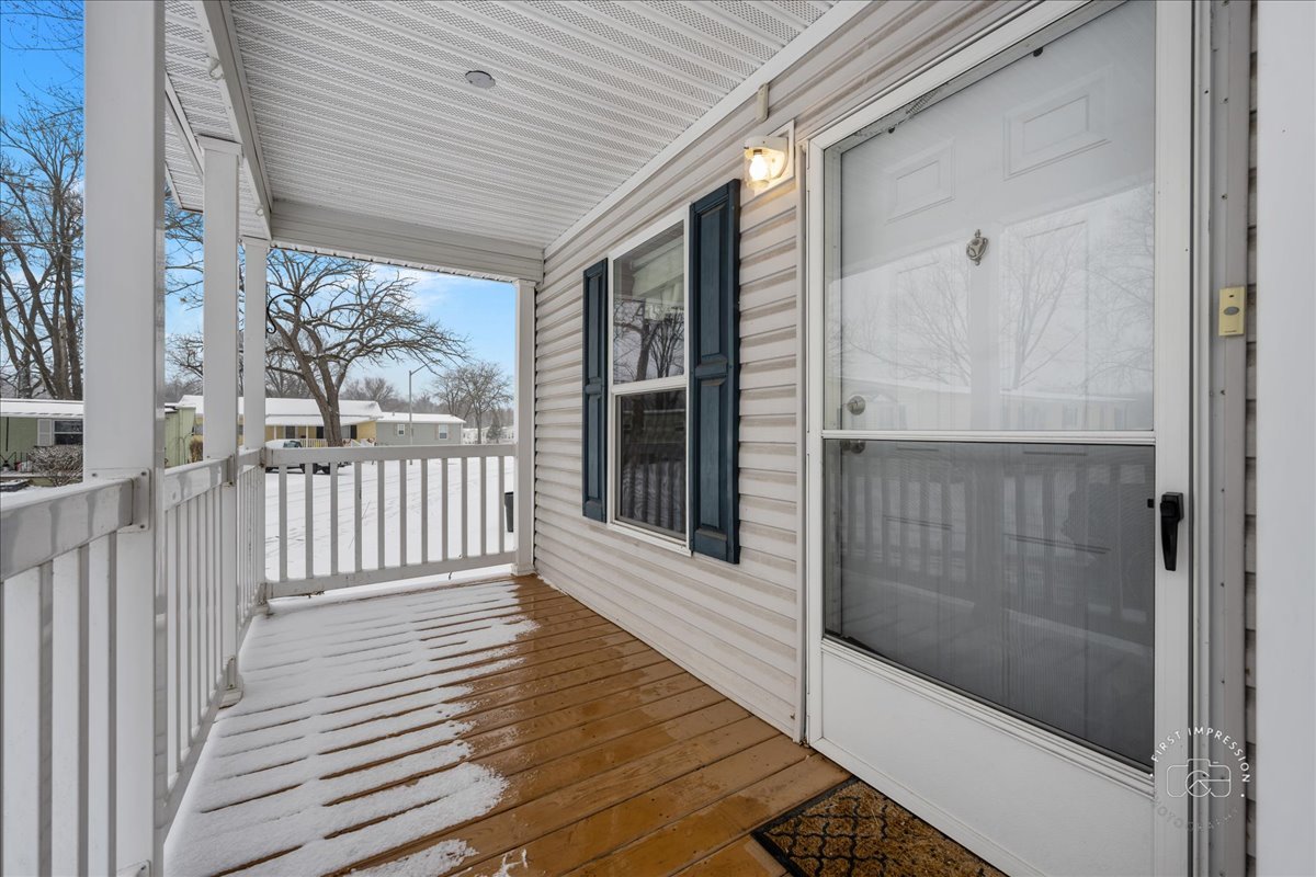 1116 Lakeview Road Elgin, IL 60123 - Photo 2 of 17 a porch with wooden floor