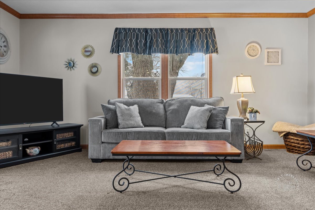 1116 Lakeview Road Elgin, IL 60123 - Photo 4 of 17 a living room with furniture and a flat screen tv