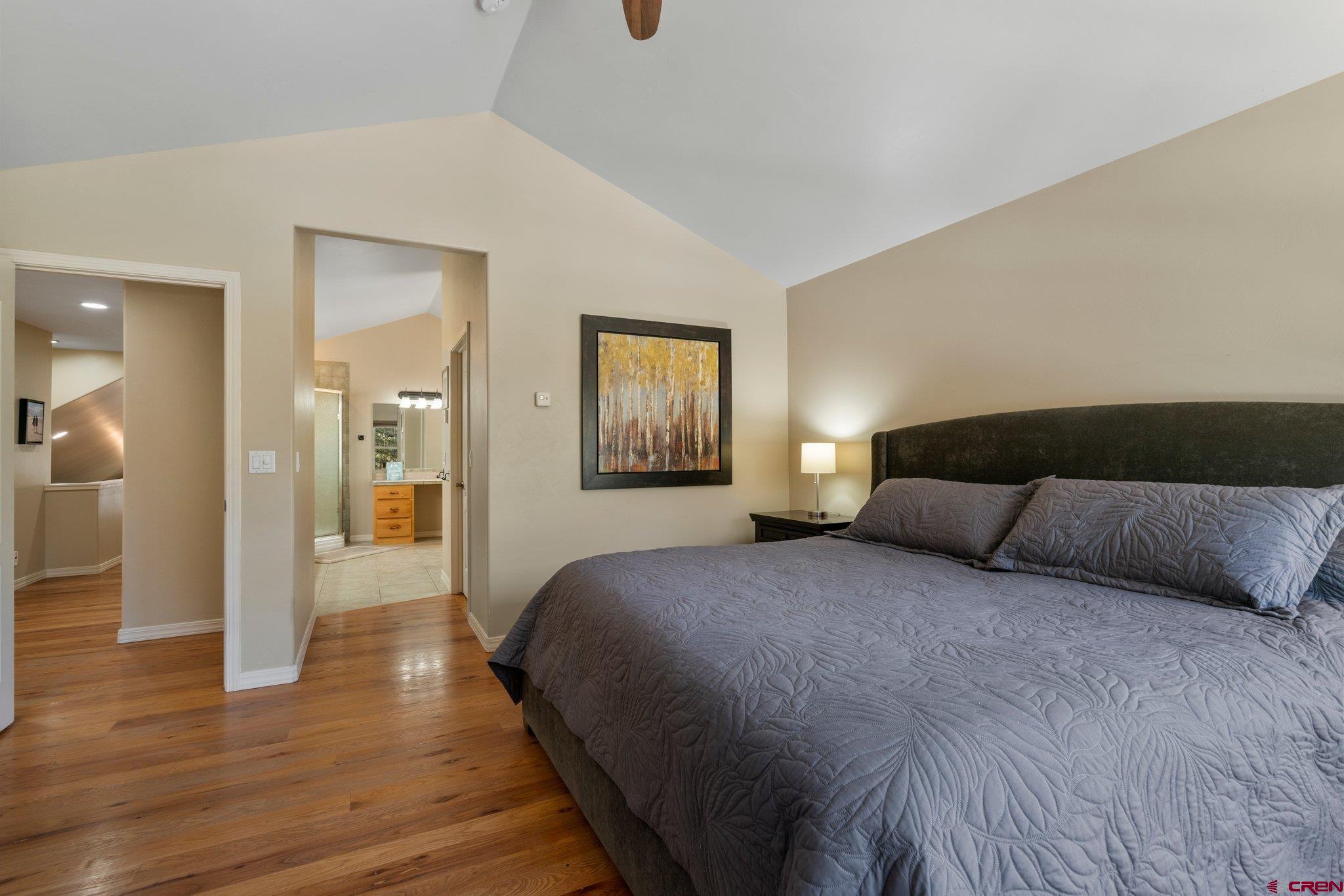 6072 County Road 240 Durango, CO 81301 - Photo 18 of 35 a bedroom with a large bed and wooden floor