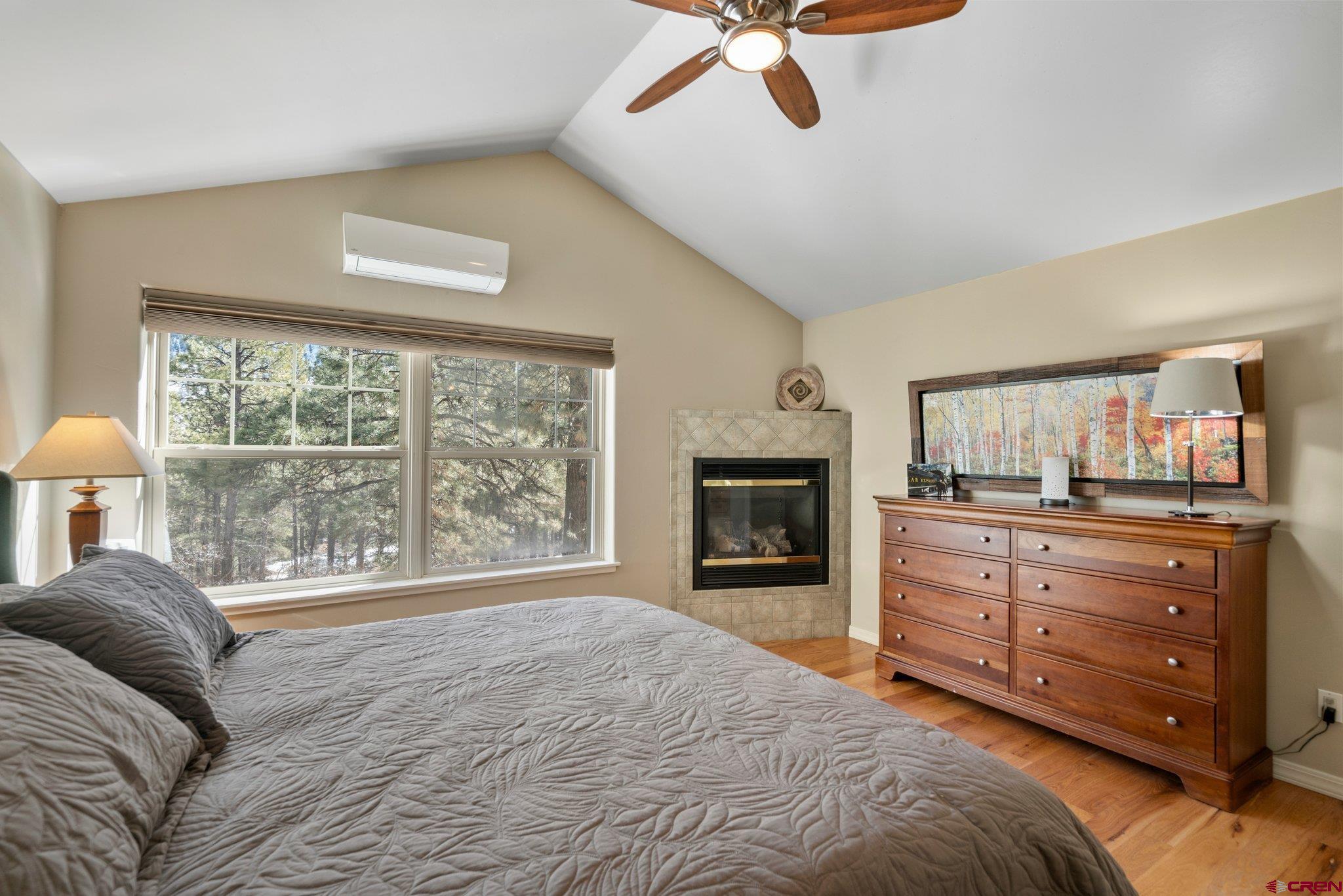 6072 County Road 240 Durango, CO 81301 - Photo 19 of 35 a bedroom with a bed and a fireplace