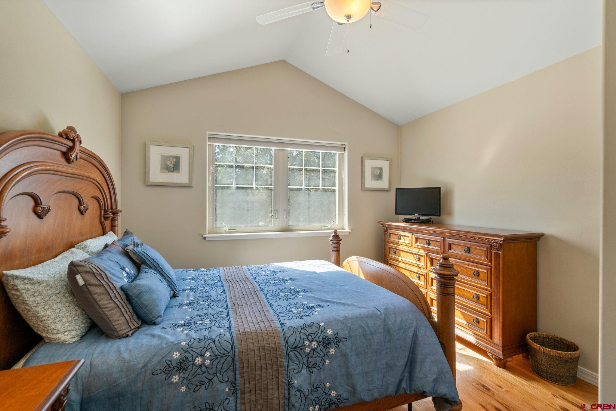 6072 County Road 240 Durango, CO 81301 - Photo 21 of 35 a bedroom with a bed and wooden floor
