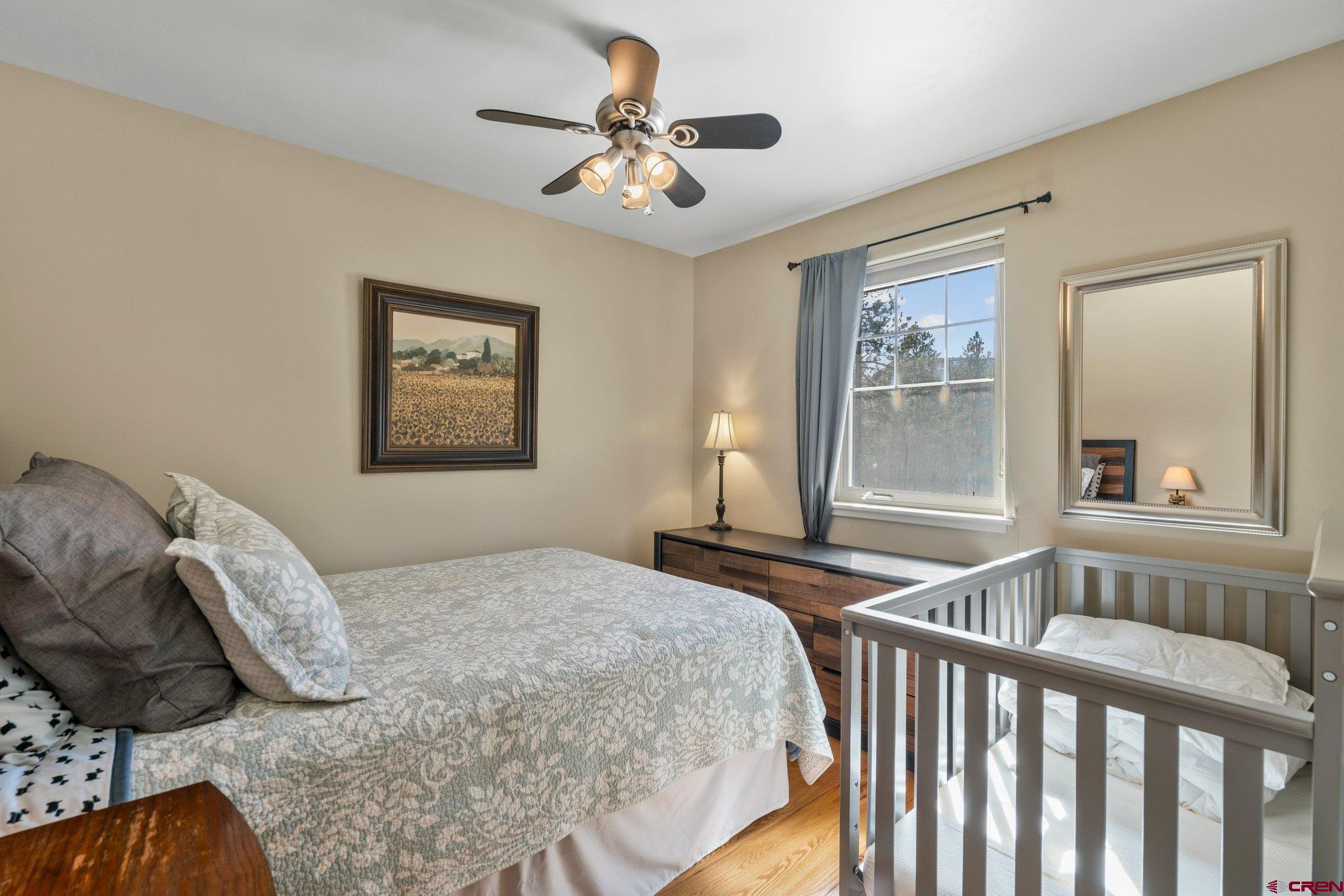6072 County Road 240 Durango, CO 81301 - Photo 24 of 35 a bedroom with a bed and a window