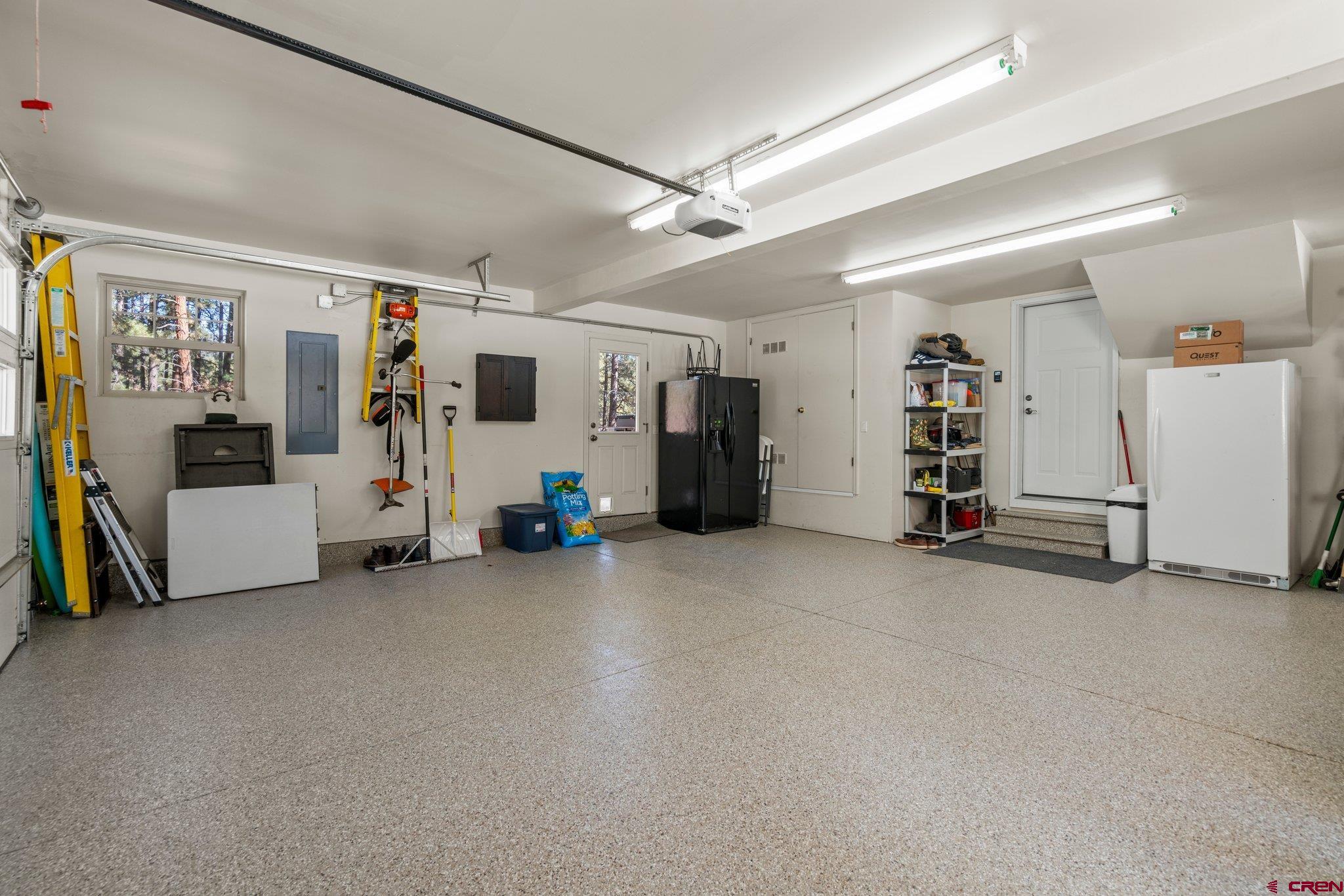 6072 County Road 240 Durango, CO 81301 - Photo 26 of 35 a view of a livingroom with gym equipment and windows