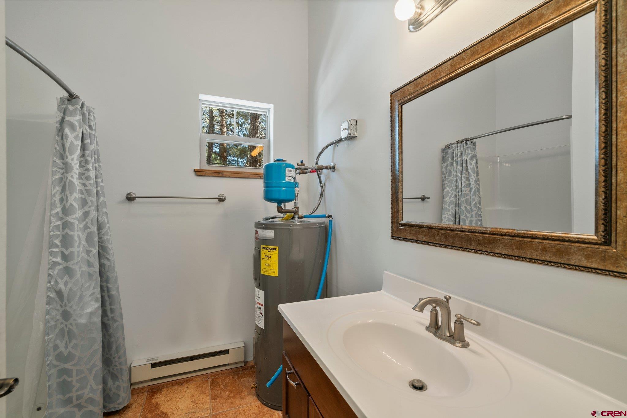 6072 County Road 240 Durango, CO 81301 - Photo 35 of 35 a bathroom with a sink and a mirror