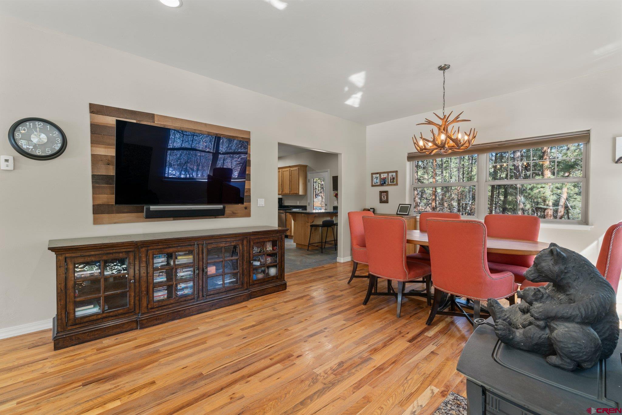 6072 County Road 240 Durango, CO 81301 - Photo 5 of 35 a living room with furniture and a flat screen tv