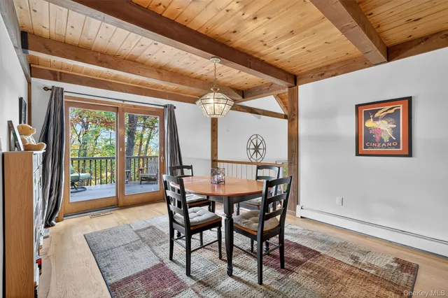 a dining room with furniture and window