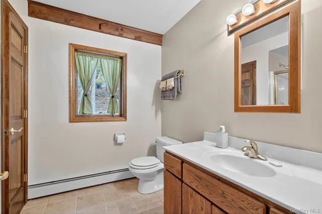 a view of balcony with wooden floor and seating space