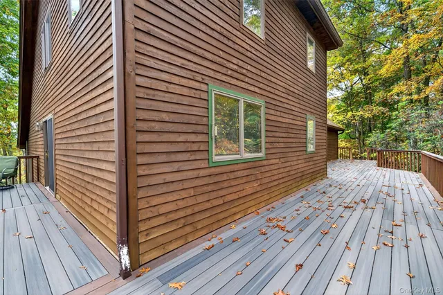 a view of balcony with wooden floor