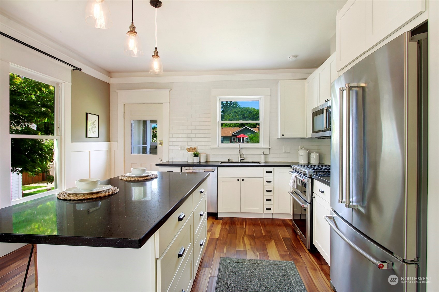 6021 48th Avenue Southwest Seattle, WA 98136 - Photo 14 of 35 a kitchen with a sink appliances and cabinets