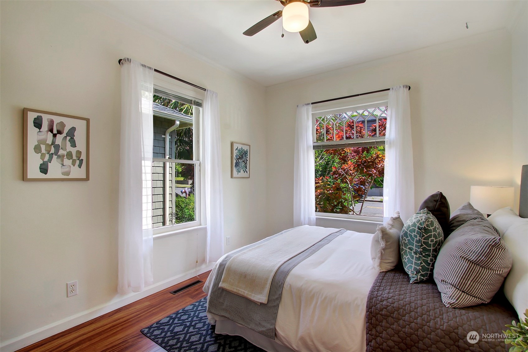 6021 48th Avenue Southwest Seattle, WA 98136 - Photo 17 of 35 a bedroom with a bed and a window