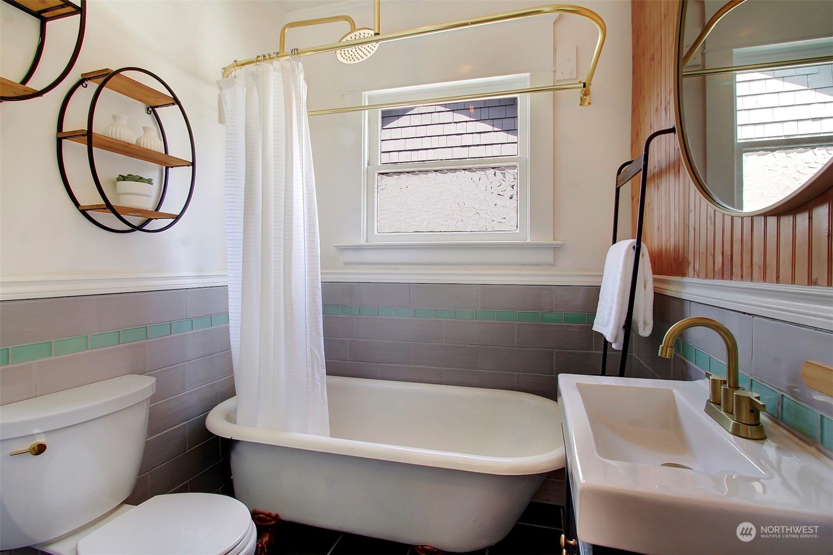 6021 48th Avenue Southwest Seattle, WA 98136 - Photo 18 of 35 a bathroom with a sink toilet and a mirror