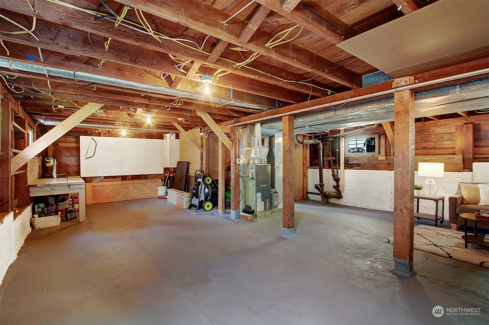 6021 48th Avenue Southwest Seattle, WA 98136 - Photo 22 of 35 a view of a room with wooden furniture