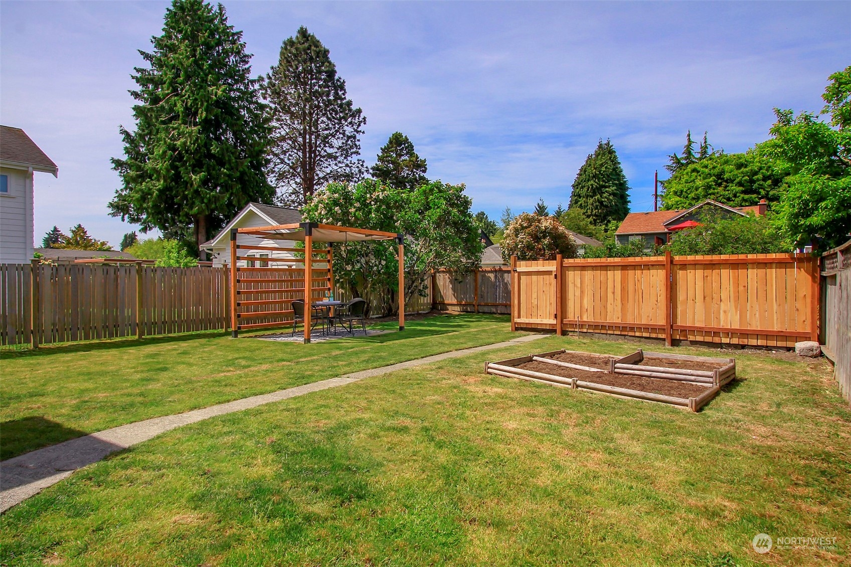 6021 48th Avenue Southwest Seattle, WA 98136 - Photo 25 of 35 a swimming pool with wooden fence