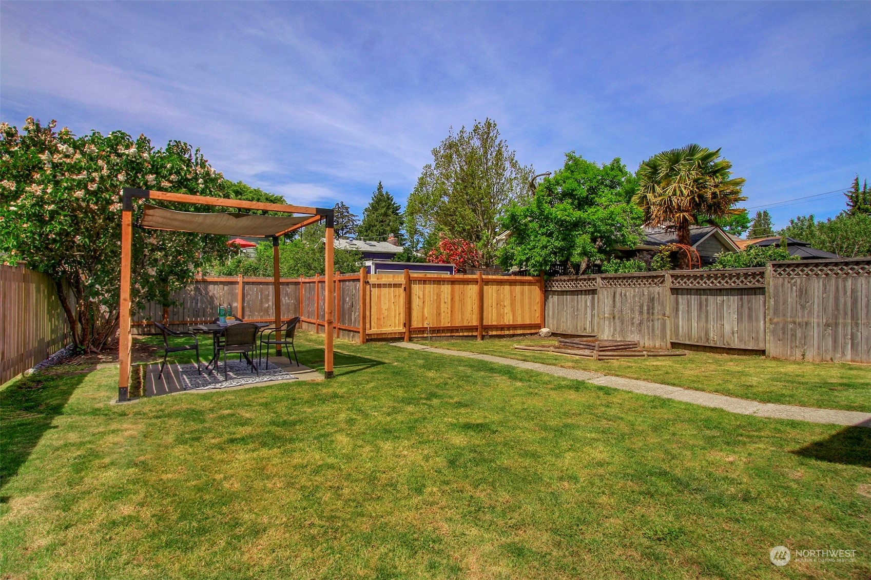 6021 48th Avenue Southwest Seattle, WA 98136 - Photo 26 of 35 a garden with wooden fence
