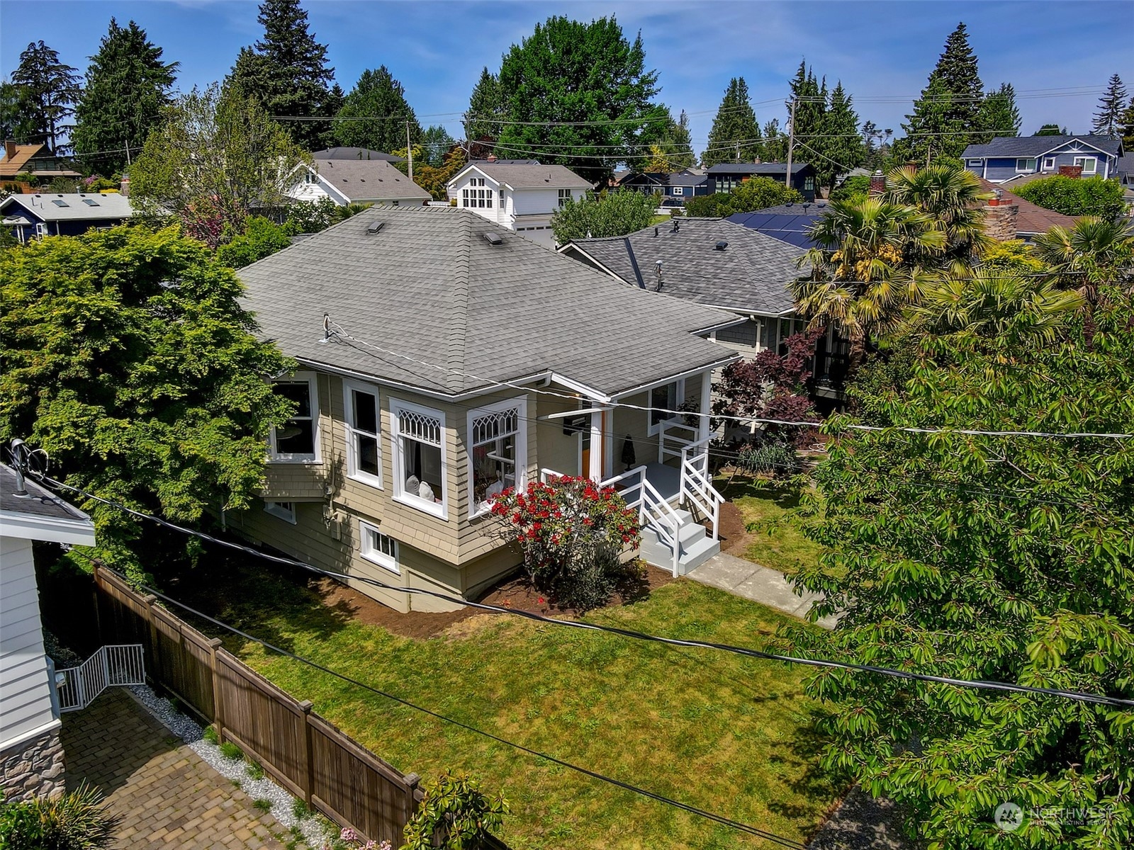 6021 48th Avenue Southwest Seattle, WA 98136 - Photo 29 of 35 an aerial view of a house with swimming pool garden view and trees