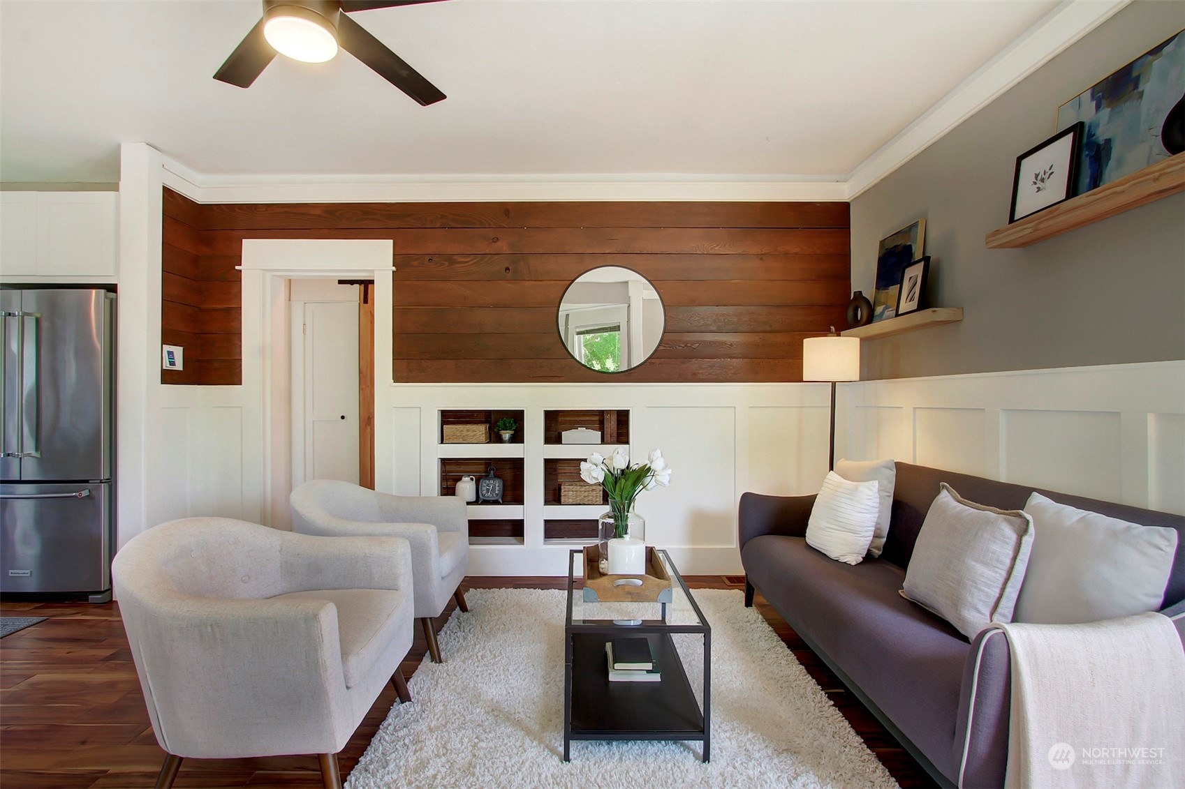 6021 48th Avenue Southwest Seattle, WA 98136 - Photo 7 of 35 a living room with furniture and a wall painting