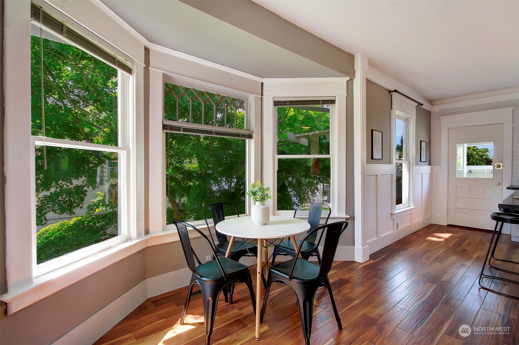 6021 48th Avenue Southwest Seattle, WA 98136 - Photo 10 of 35 a view of a dining room with furniture window and wooden floor