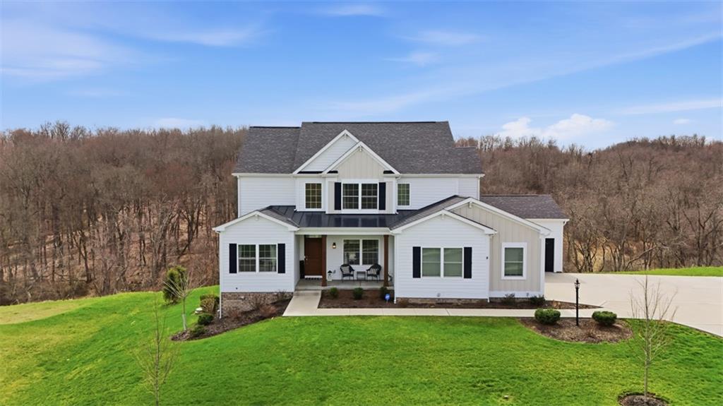 213 Hickory Lane Mars, PA 16046 - Photo 1 of 46 a front view of a house with a yard