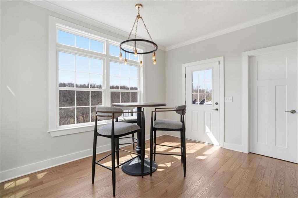 213 Hickory Lane Mars, PA 16046 - Photo 18 of 46 a view of a dining room with furniture window and wooden floor