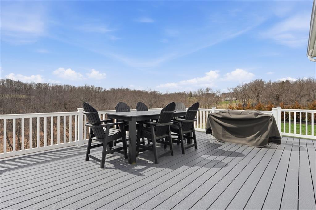 213 Hickory Lane Mars, PA 16046 - Photo 19 of 46 a view of a roof deck with table and chairs a barbeque with wooden floor and fence