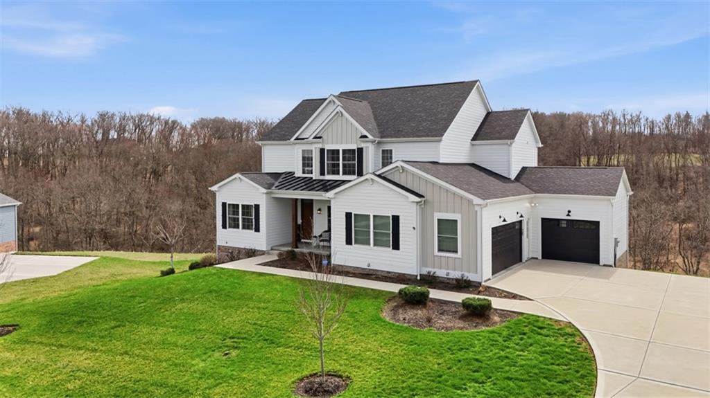 213 Hickory Lane Mars, PA 16046 - Photo 2 of 46 a front view of a house with garden