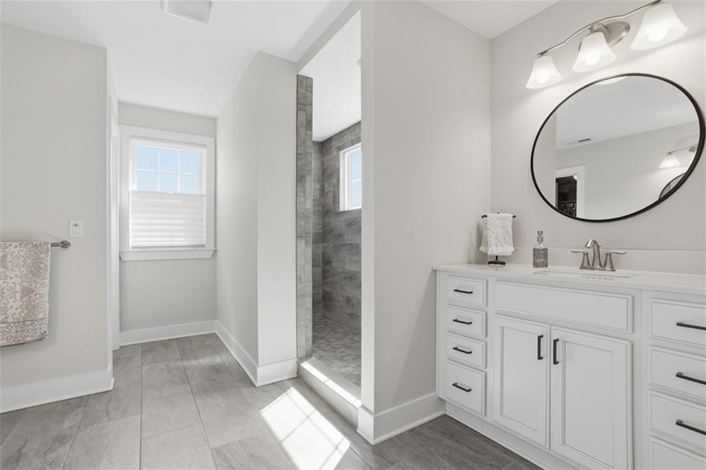 213 Hickory Lane Mars, PA 16046 - Photo 23 of 46 a bathroom with a sink a toilet and a mirror