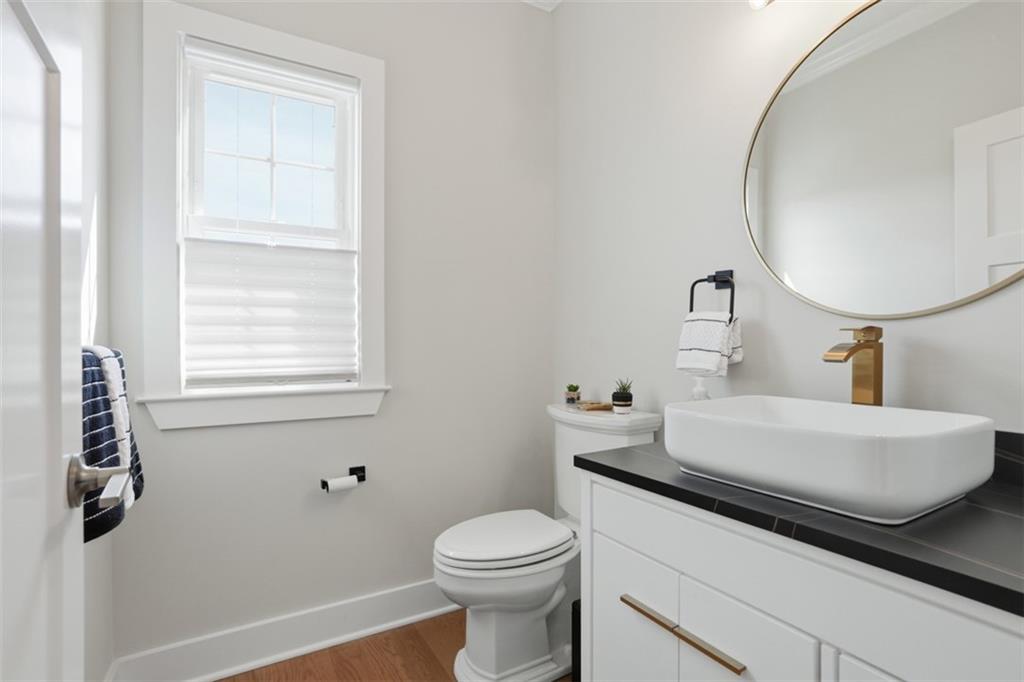 213 Hickory Lane Mars, PA 16046 - Photo 27 of 46 a bathroom with a sink a toilet and a mirror