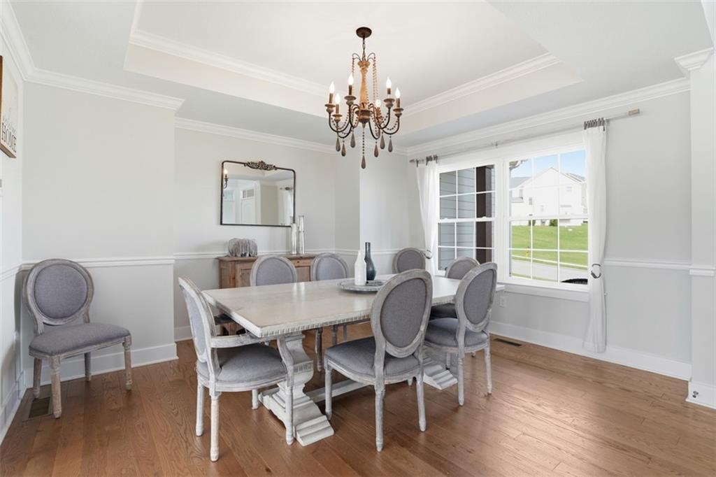 213 Hickory Lane Mars, PA 16046 - Photo 8 of 46 a view of a dining room with furniture wooden floor and chandelier