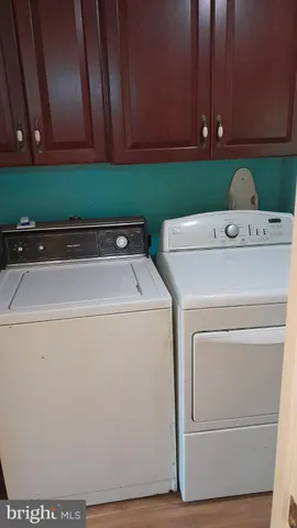 a bathroom with a toilet and a bath tub