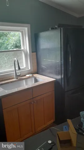 a close view of sink and cabinets