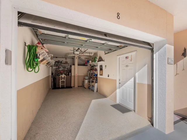 a view of water heater room with furniture and a window