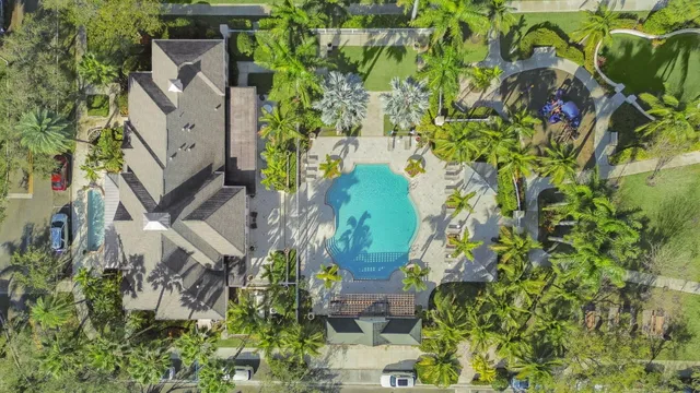 an aerial view of a house with a yard