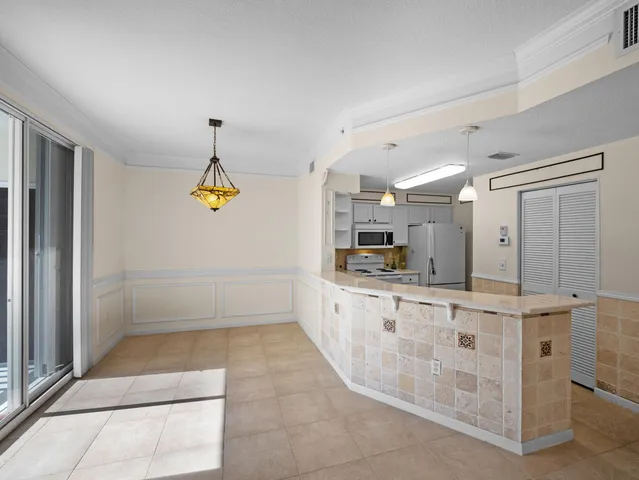 a bathroom with a sink a toilet a mirror and window