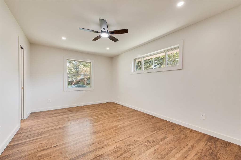 3106 Sharpview Lane Dallas, TX 75228 - Photo 26 of 33 a view of an empty room with wooden floor and a window
