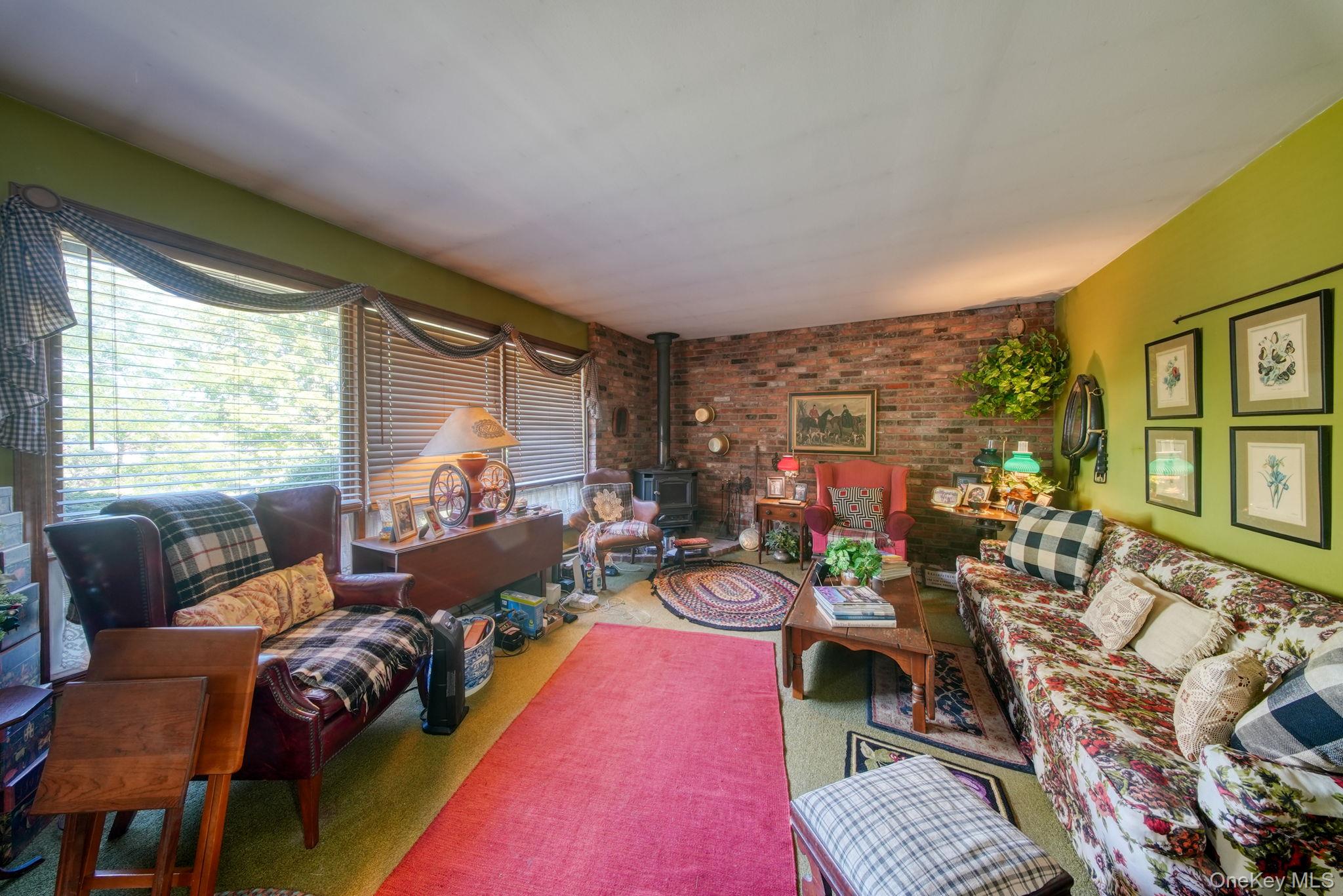 128 Hall Road Grahamsville, NY 12740 - Photo 12 of 34 a living room with furniture and a large window