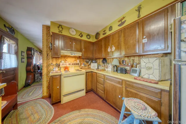 a kitchen with stainless steel appliances granite countertop a sink and cabinets