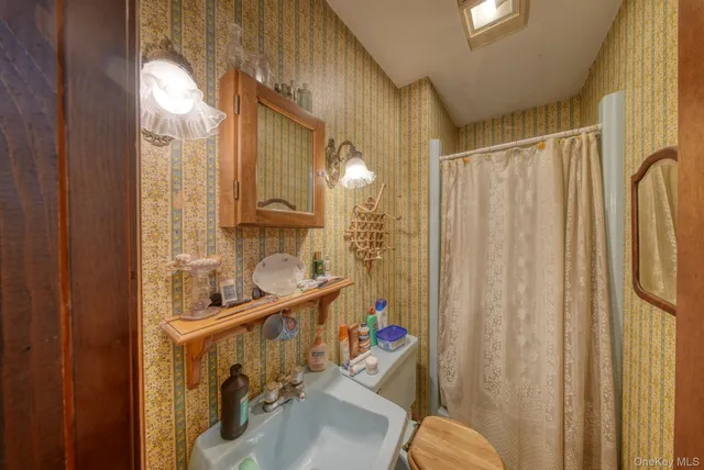 a bedroom with a bed closet and flat tv screen