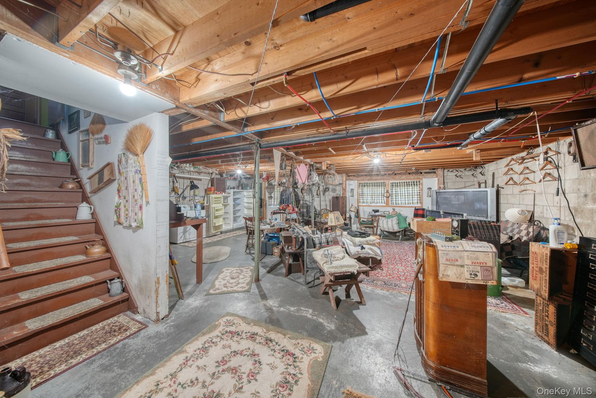128 Hall Road Grahamsville, NY 12740 - Photo 26 of 34 a living room with lots of furniture and a rug
