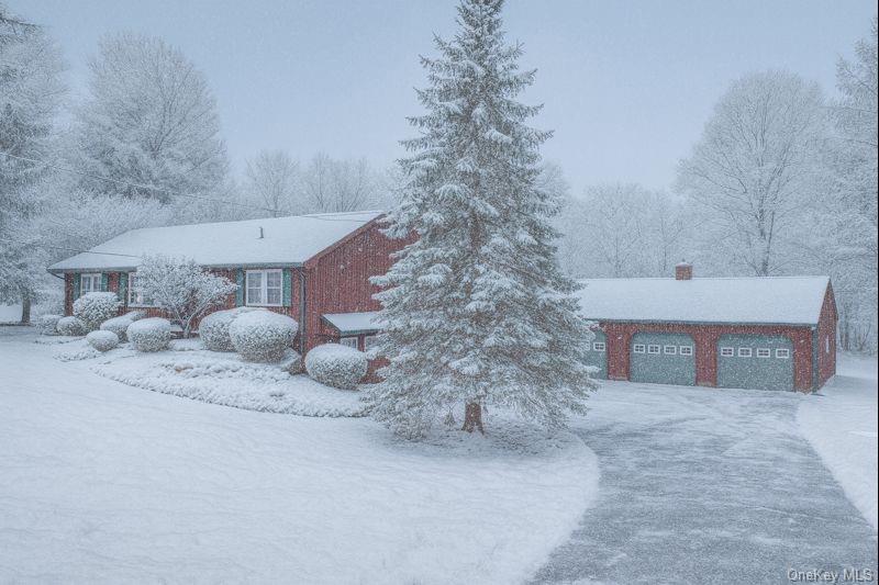 128 Hall Road Grahamsville, NY 12740 - Photo 33 of 34 View of snowy exterior with a garage and a chimney