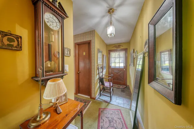 a view of a livingroom with furniture and windows