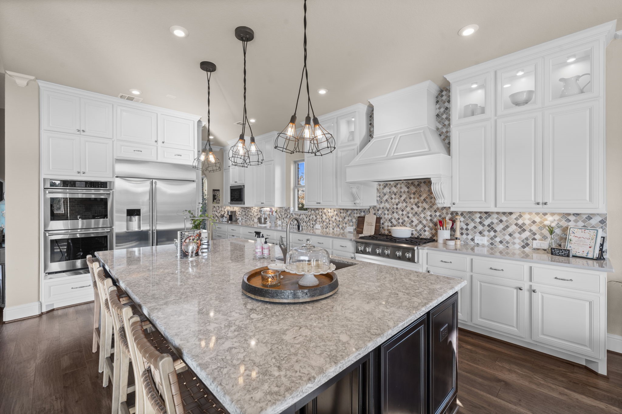 2203 Flameleaf Court Conroe, TX 77384 - Photo 14 of 49 a kitchen with sink a microwave and cabinets