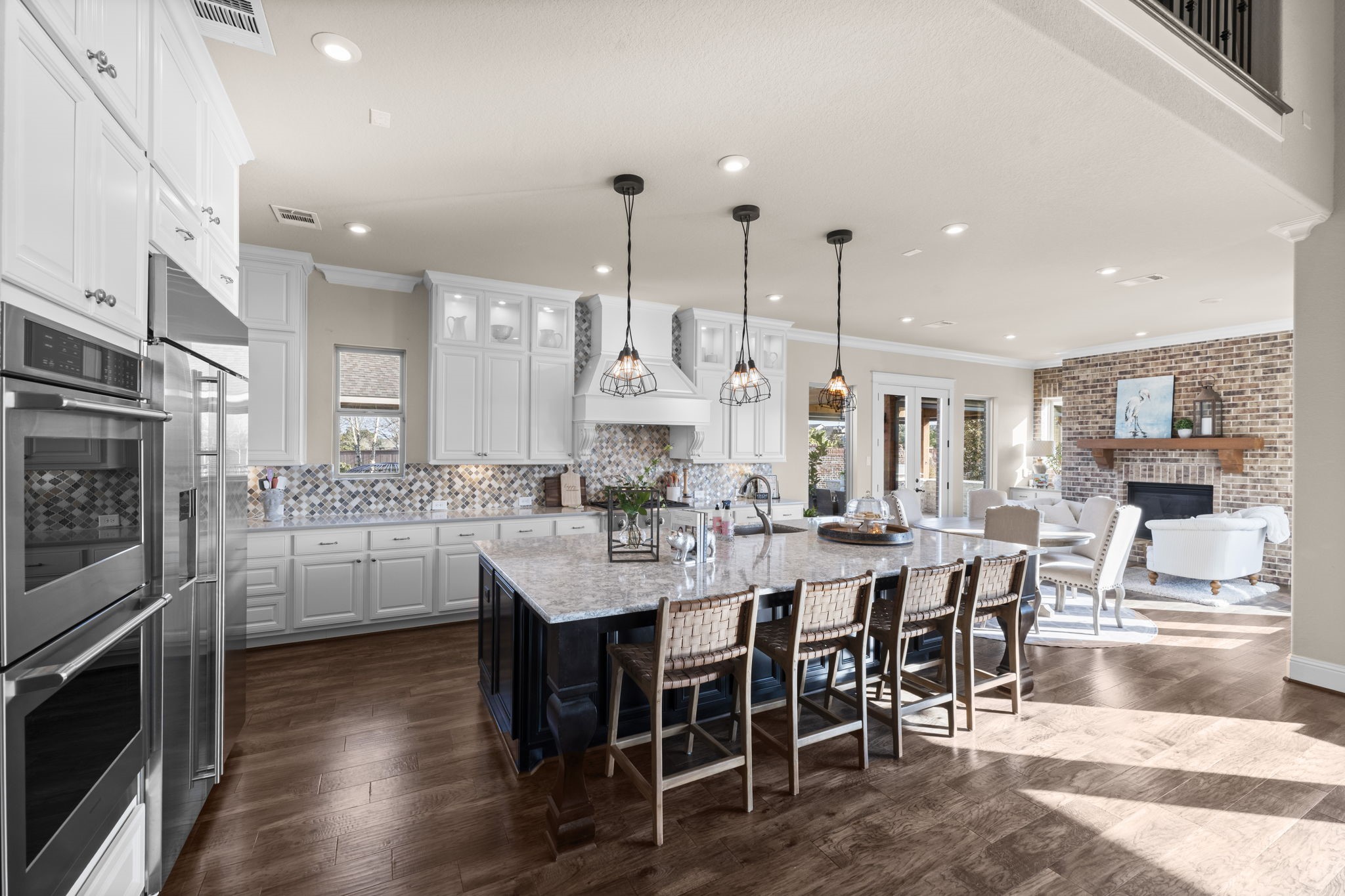 2203 Flameleaf Court Conroe, TX 77384 - Photo 16 of 49 a large kitchen with a table and chairs