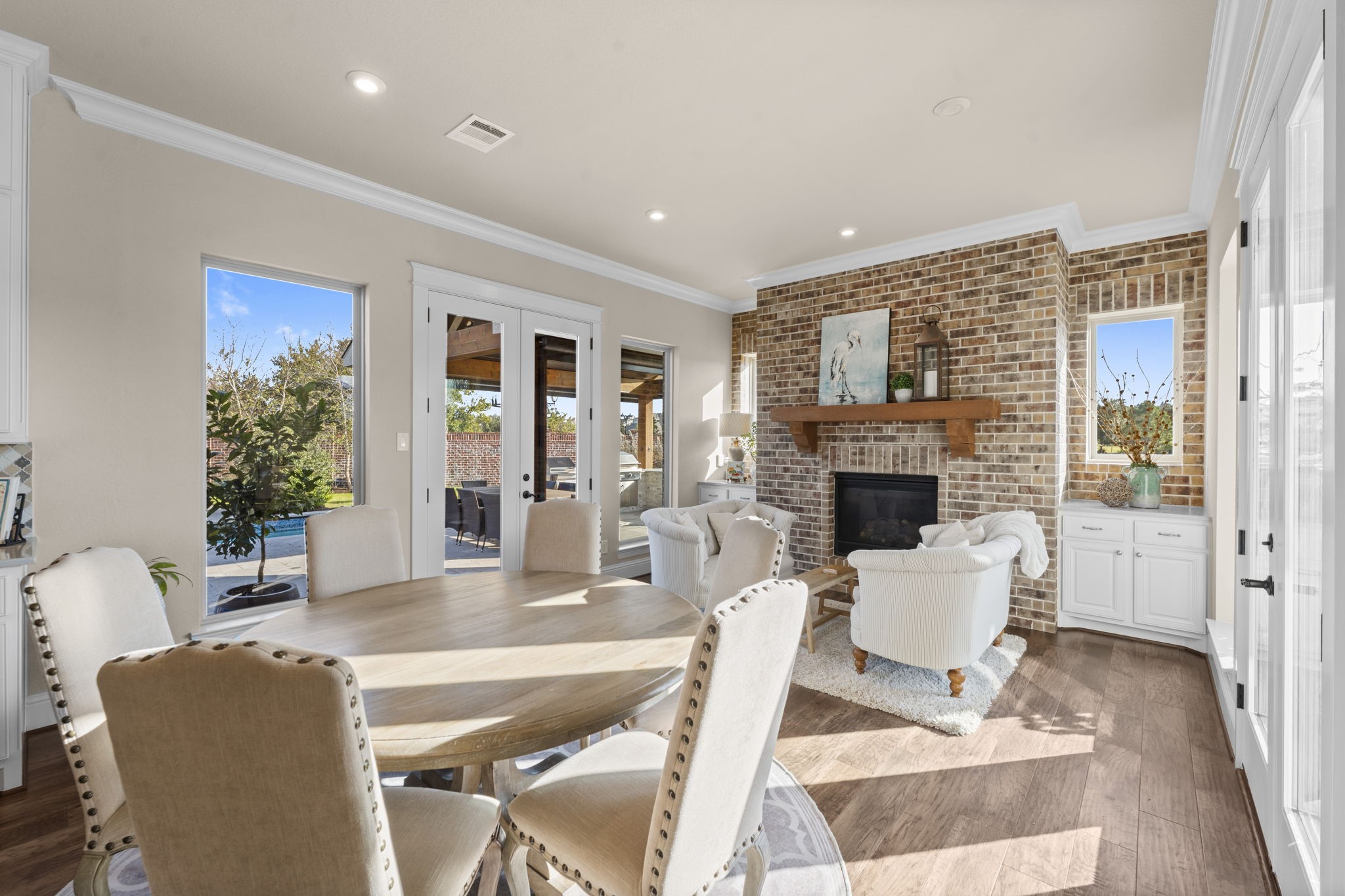 2203 Flameleaf Court Conroe, TX 77384 - Photo 19 of 49 a living room with furniture a fireplace and a table